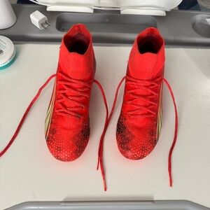 Puma Kids Cleats in Red and Yellow